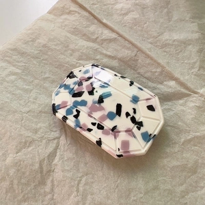 Blue acetate starburst hair clip with terrazzo pattern and polished gemstone cut design