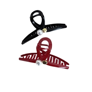 Red and black resin shark hair claws with large pearl and gold medal detail
