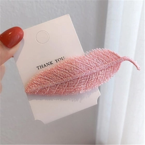 Elegant pink feather-shaped woven hair clip with fine embroidery on display card