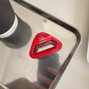 Hollow triangular acetate hair claw in elegant red for stylish half-up hairstyles