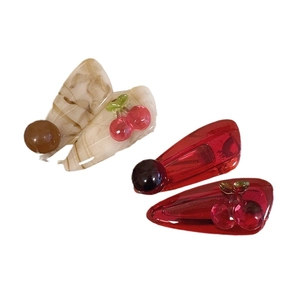Three-piece cherry hair clip set with red translucent and beige marble resin textures