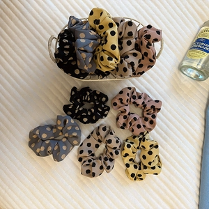 Five-piece set of satin polka dot scrunchies in assorted colors for ponytail styling