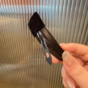 Elegant black velvet bow hair clip on a metal spring base for vintage styling
