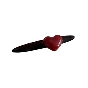 Minimalist red heart hair clip with a black base for women, stylish New Year accessory