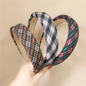 Three stylish plaid sponge headbands in brown, gray, and green for a preppy look