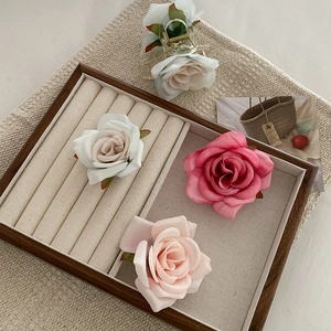 Realistic fabric rose flower hair claw clips in white and pink for vacation hair styling