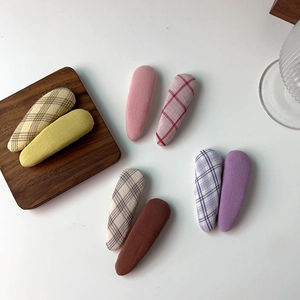 Close-up of 8 pieces of fabric candy-colored checkered snap hair clips for girls