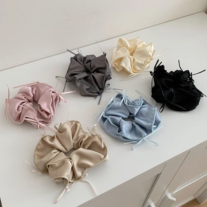 Set of six colorful satin bow hair scrunchies in sweet ballet style on white background