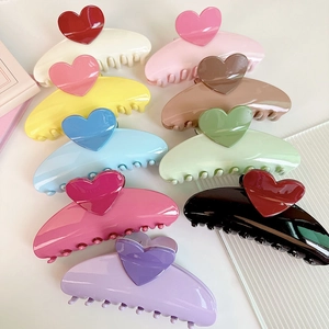 Detail shot of multi-color heart claw clips in contrasting dopamine hues, 13cm size