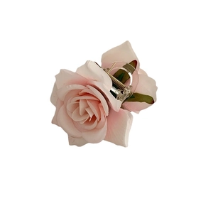 Elegant pink fabric rose hair claw clip with green leaves for spring vacation hairstyles