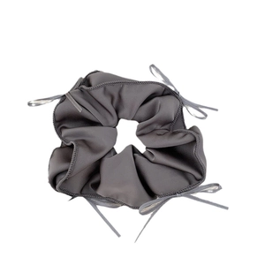 Grey ballet style scrunchie with satin ribbon bows and elegant textured finish