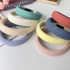 Detail of multi-colored thickened sponge headbands with fine diagonal fabric texture