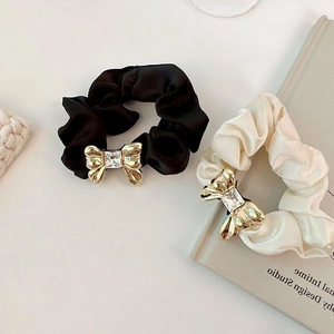 Luxurious satin hair scrunchies with golden metal bow and crystal rhinestone accents