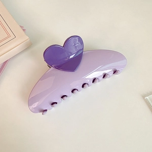 Macro detail of a 13cm oversized light purple hair claw clip with dark purple hearts