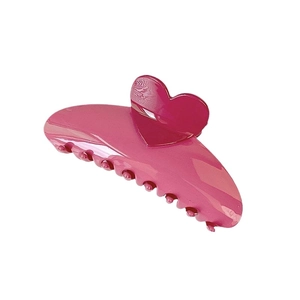 Vibrant magenta hair claw clip with heart design for thick hair styling on white background