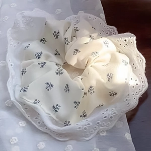 Floral scrunchie with white lace edges in ballet style and vintage aesthetic