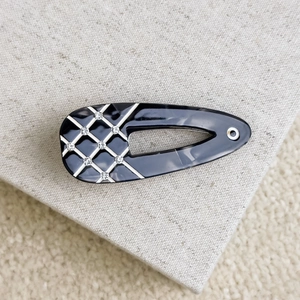 Water-drop acetate hair clip with black diamond lattice and rhinestone accents
