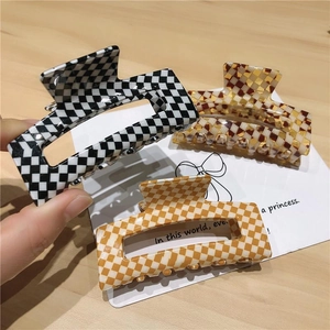 Pinces à cheveux vintage en acétate avec motif à carreaux noir, marron et orange vif