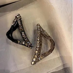 Elegant triangular hair claws in black and smoke grey with sparkling rhinestones