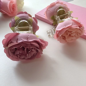 Elegant artificial rose flower hair claws in dusty purple and pink for women's hairstyling