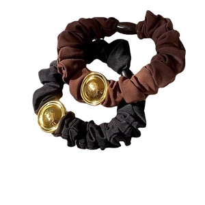 Elegant black and dark brown hair scrunchies set with minimalist gold metal buckle charms