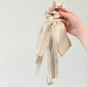 Elegant cream satin bow scrunchie with lace ribbons and pearl accent for women