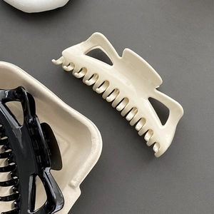 Oversized minimalist hair claw clips in beige and black for thick hair styling