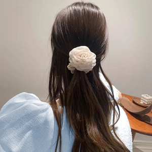 Elegant white mesh rose hair tie with pearls for women shown from the back hairstyle