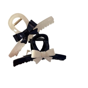Elegant black and white contrast bow hair claws with non-slip teeth for women
