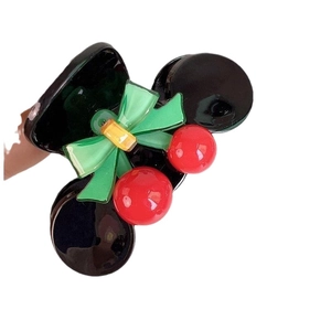 Sweet cherry hair claw clip in glossy black acrylic with green bow and red cherry accents