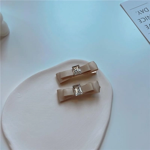 Elegant set of two Audrey Hepburn style bow hair clips with a vintage square diamond accent