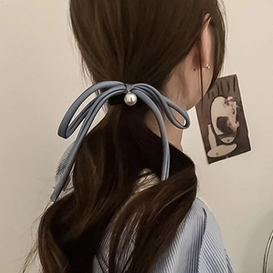Elegant Morandi blue satin ribbon hair tie with pearl pendant on a ponytail