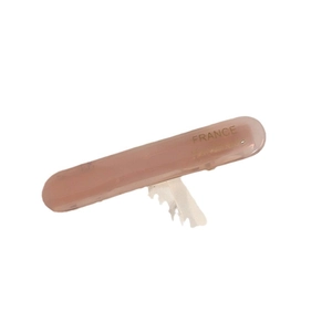 Minimalist dusty pink acetate hair clip with golden handmade lettering on white background