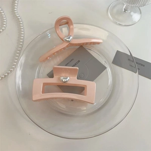Pink heart-accented hair claw clips set including curved and rectangular resin designs
