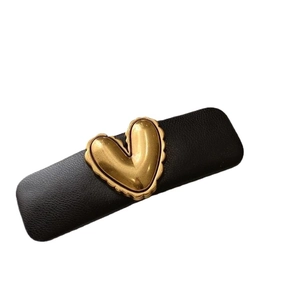 Retro black PU leather sponge hair clip featuring a vintage gold 3D heart design