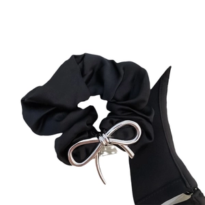 Elegant black fabric scrunchie with a minimalist silver metal bow charm for women