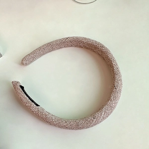 Detail of the thick padded pink plaid headband with premium woven texture surface