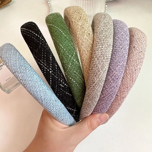 Detail of 7 colors tweed padded headbands with textured weave fabric in various pastel tones