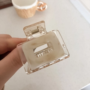 Minimalist square hair claw clip in cream marble resin with gold metal spring for women