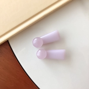 Detailed macro view of lavender floral hair clip accessories in soft matte resin finish