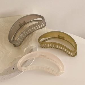 Three-piece set of large crescent hair claws in grey, olive green, and beige colors