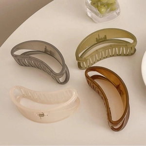 Large crescent hollow hair claws in four colors including translucent grey and amber brown