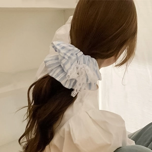 Blue and white striped scrunchie with white lace trim shown on a ponytail