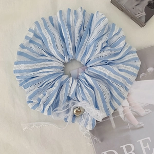Blue striped oversized scrunchie with white lace trim and a silver heart pendant charm