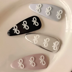 Set de 4 horquillas BB con lazo de perlas en negro plata azul y rosa para peinados diarios