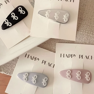 Pinzas para el pelo estilo coreano con lazos de perlas sintéticas en negro, rosa y azul