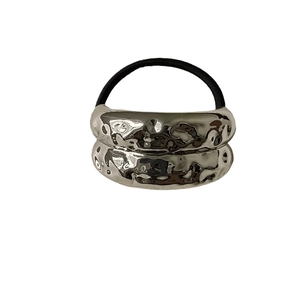 Minimalist silver liquid metal elastic hair tie with a textured geometric design