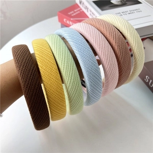 Close-up of assorted colorful waffle texture knitted headbands with sponge padding