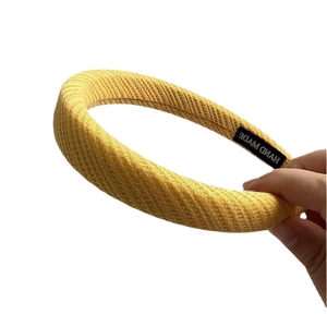 Creamy waffle texture ginger yellow wide sponge headband with handmade woven label