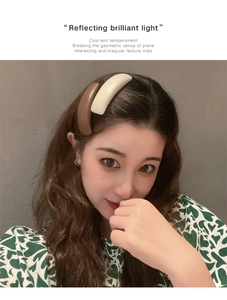 Detail of irregular geometric hair clips in milk tea colors on a female model